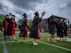 graduates walking on Sprague field