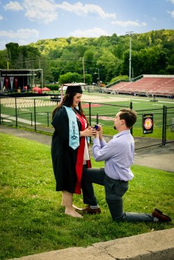 photo of Tyler Frantino on his knees, proposing to Diana Sisk-Gritz