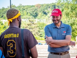 President Koppell speaking with a student