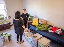 student and parent speaking in dorm room