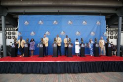 all inductees pose on stage