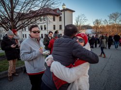 Two people embrace on campus