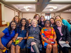 A group of nursing faculty members smiling