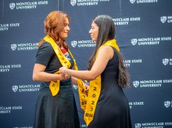 Two sisters show emotion during ceremony.