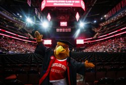 Montclair State mascot Rocky the Red Hawk in graduation cap at commencement.