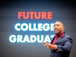 A man speaks in front of a sign that says "Future College Graduates"