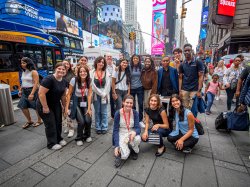 Students pose in Times Square.