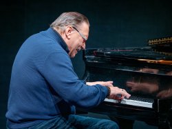 Arturo Sandoval plays the piano.