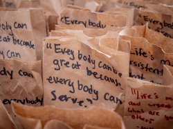 Lunch bags with inspiring MLK quotes, such as. "Everybody can be great because everybody can serve."
