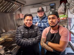 Three men inside the Señor Tacos food truck