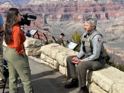 Yazemin Yilmaz interviews National Park Service Ranger Adam Sherman overlooking the Grand Canyon.