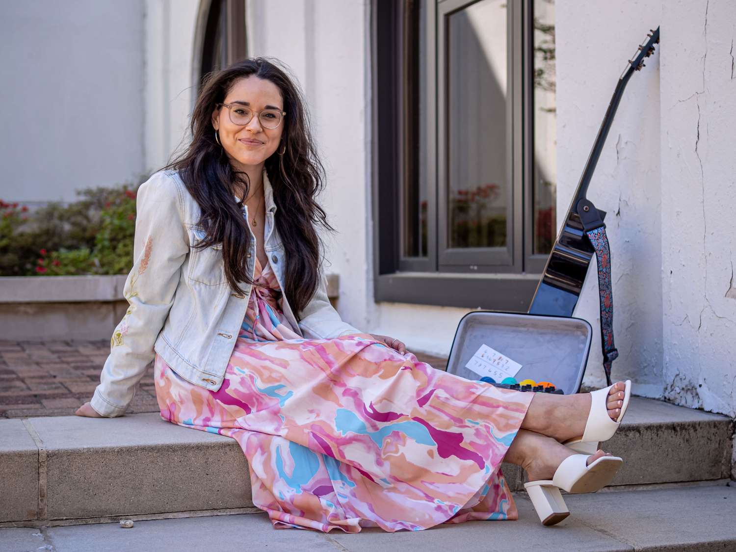 Alyssa Muñiz sits on a step.