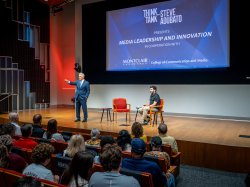 Steve Adubato and President Jonathan Koppell on stage, addressing the audience