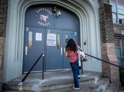 Sara climbs the steps to enter Eastside High School in Paterson, where she teaches English classes for adults.