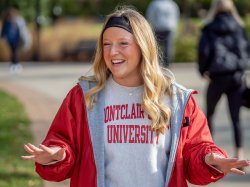 Emma Haskell wears a Montclair State University sweatshirt as she leads a campus tour.