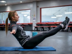 Olga Mikutina balances in a V-sit position.