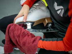 Olga Mikutina's name is engraved on the blade of her ice skate.