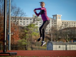 Olga Mikutina jumps and spins on the track.