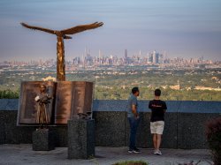 Visitors take in the Manhattan skyline view from the Eagle Rock Observation Deck.