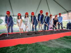 Montclair leaders digging shovels into ground at groundbreaking event.
