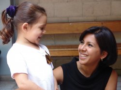 Child advocate smiling at young child