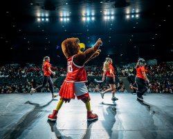 rocky and orientation leaders on the stage with lights