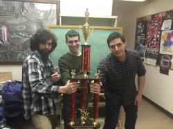 from left: Albert Jarvis, Hanon Zatloff and Brian Giraldo holding their Quiz Bowl trophy