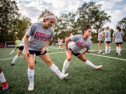 MSU soccer players stretching.