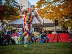 Red Blanket Singers member participating in tribal dance