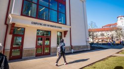 student walking outside CCIS building