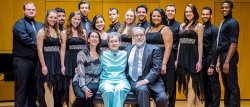 Photo of Christine Consales, Kay Consales and J. Douglas Peters (seated) with Musical Theatre and Vocal Performance majors of the John J. Cali School of Music who performed at the dedication ceremony under the direction of Professors Clay James and Gregory J. Dlugos.