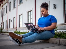 Student sitting on a laptop