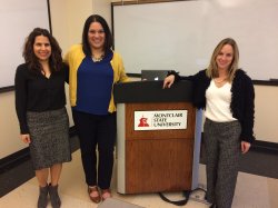 three women at podium