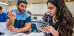 two students making calculations on lab test data