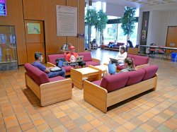 Inside of the Student Center, second floor lobby with students sitting on couches