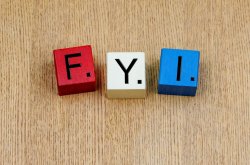 Image of three wooden blocks on a wood table. Each block as a letter as used in a Scrabble game: F Y I.
