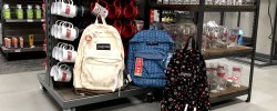 Picture of Jansport backpacks and Montclair State emblematic drinkware in the University Bookstore.