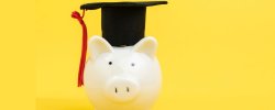 Picture of a piggy bank and graduation cap.