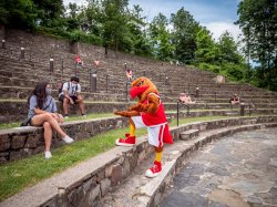 Rocky with some students in the amphitheater