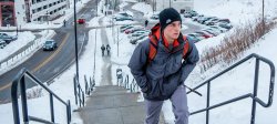 Image of student climbing stairs by CarParc in the snow