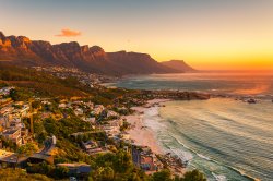 A wide picture of Clifton Beach in Cape Town, South Africa at late afternoon in a beautiful sunset.