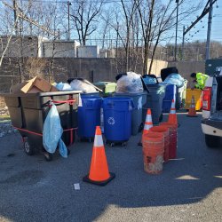Photo of trash & recycling in containers collected for a waste audit.