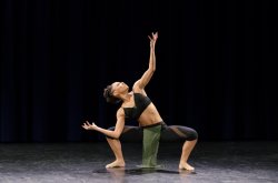 Interpretative Dancer on stage gesturing upward