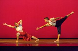 Photo of male and female dancers in extreme stretching poses.