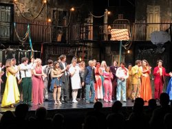Lawrence Cohen with the cast of his musical Carrie onstage at the Memorial Auditorium