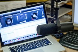 Close-up photo of microphone with laptop in WMSC Radio Station, in the Student Center, in 2012