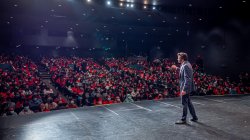 Montclair State President Jonathan Koppell on stage looking out at the audience in Memorial Auditorium
