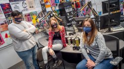 Three award winning students pose in the WMSC studio
