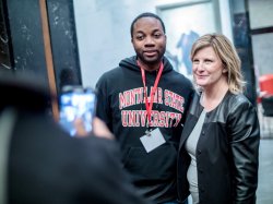 Associate Professor Kelly Whiteside posing with student