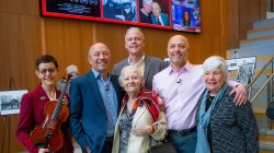 the Ravina family in the school of communication and media lobby